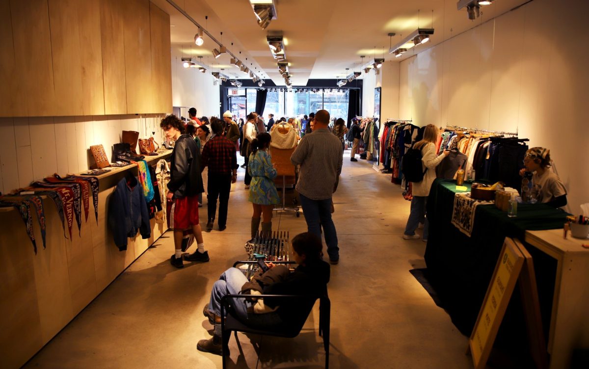 Customers browse through various vintage selections at the Vintage House pop-up in Wicker Park on Sunday, Feb. 25, 2024. The pop-up hosted multiple vendors who all carried a variety of clothing and accessories.