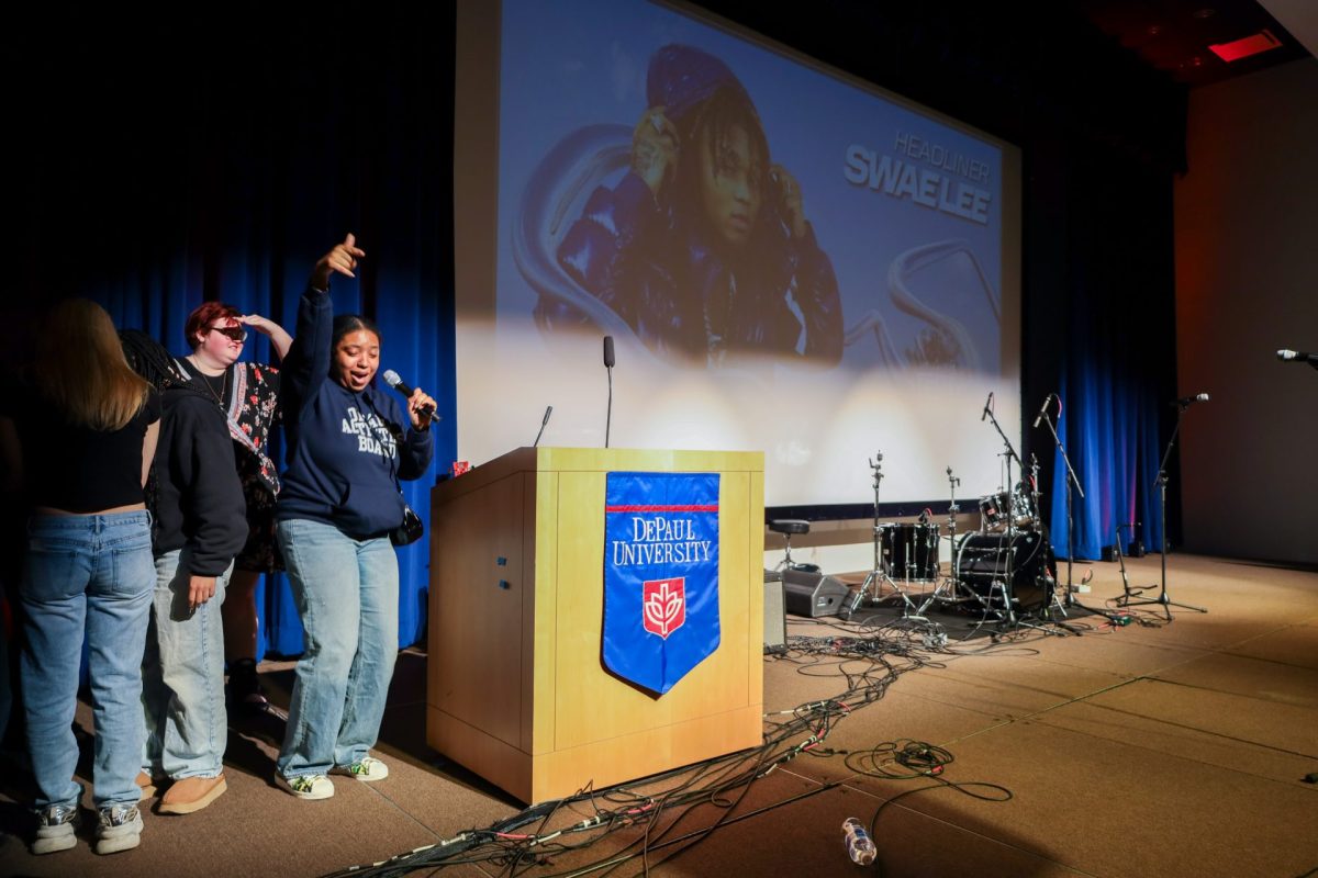 Clevanique Edwards, junior and co-concert chair of the DePaul Activities Board, celebrates the FEST 2024 artist announcement in Depaul University’s Student Center room 120AB on April 24. Rapper Swae Lee will headline the event. DAB plans to announce the opener on social media on May 1.