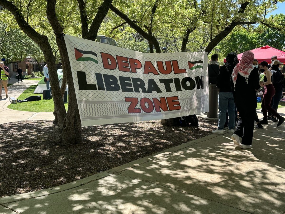 A sign reads DePaul Liberation Zone on DePauls Quad shortly after protestors began an encampment for divestment on Tuesday, April 30, 2024.