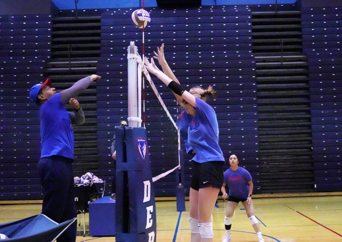 DePaul+volleyballs+front-line+practices+blocking+at+a+team+practice+Thursday%2C+April+11%2C+at+McGrath-Phillips+Arena.+The+court+pictured+is+the+only+space+available+for+the+teams+use+during+the+spring+season.