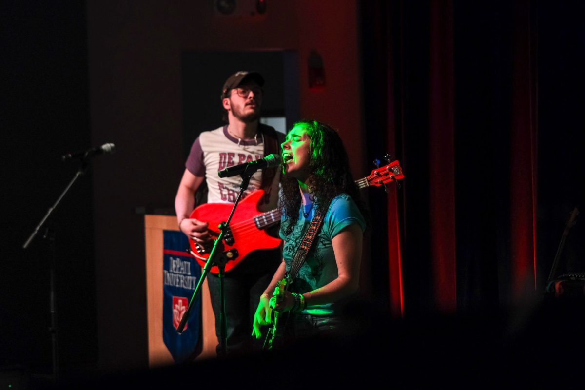 Maura Wolf of Ur Mom sings during the final performance of the Battle of the Bands in the Student Center on Wednesday, April 24, 2024. Attendees casted ballots at the end of the night to decide who would win.
