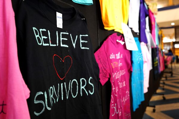 Student designed T-shirts are displayed in the Student Center Atrium for the Clothesline Project Exhibition on Thursday, April 25, 2024. The color of the T-shirts represent different aspects of violence against women.