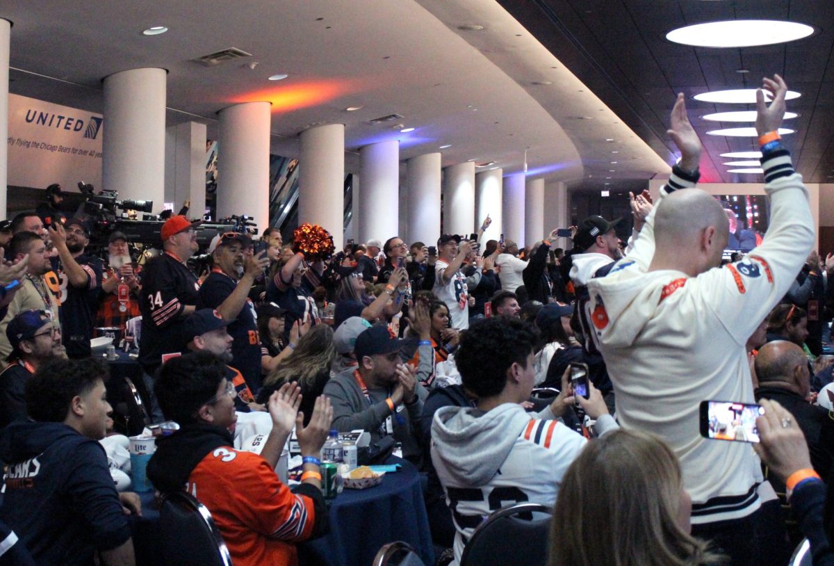 Chicago Bears fans react to the teams selection of University of Southern California quarterback Caleb Williams first overall in the 2024 NFL Draft April 25, at Soldier Field.