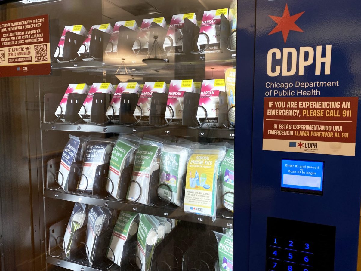 A vending machine stocked with narcan and other forms of aid stands on the 3rd floor of Harold Washington Library in the Loop on Saturday, April 20, 2024. Machines like this are being installed in locations across the city as a way of making life-saving medication more accessible.
