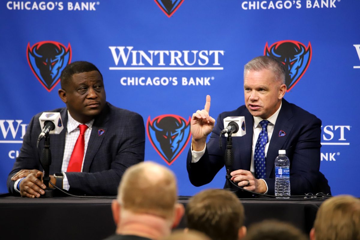 DePaul+head+coach+Chris+Holtmann%2C+left%2C+gives+his+introductory+press+conference+Monday%2C+March+18%2C+2024%2C+at+Wintrust+Arena.+Holtmann%E2%80%99s+plans+for+the+team%E2%80%99s+future+was+the+main+topic+of+discussion.