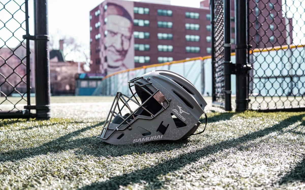 A catchers helmet rests in the batting cage before a DePaul vs Georgetown match March 9, 2024, at Cacciatore Stadium.