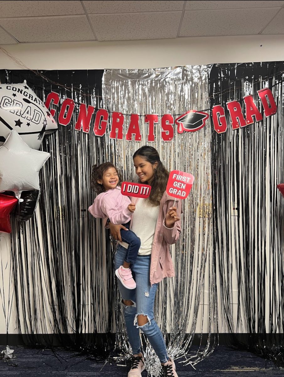 Ilse Arciniega holds her daughter and poses for a photo at a graduation celebration in June 2022. Arciniega is a DePaul graduate student and mother who is graduating June 2024 after achieving her Masters degree. 