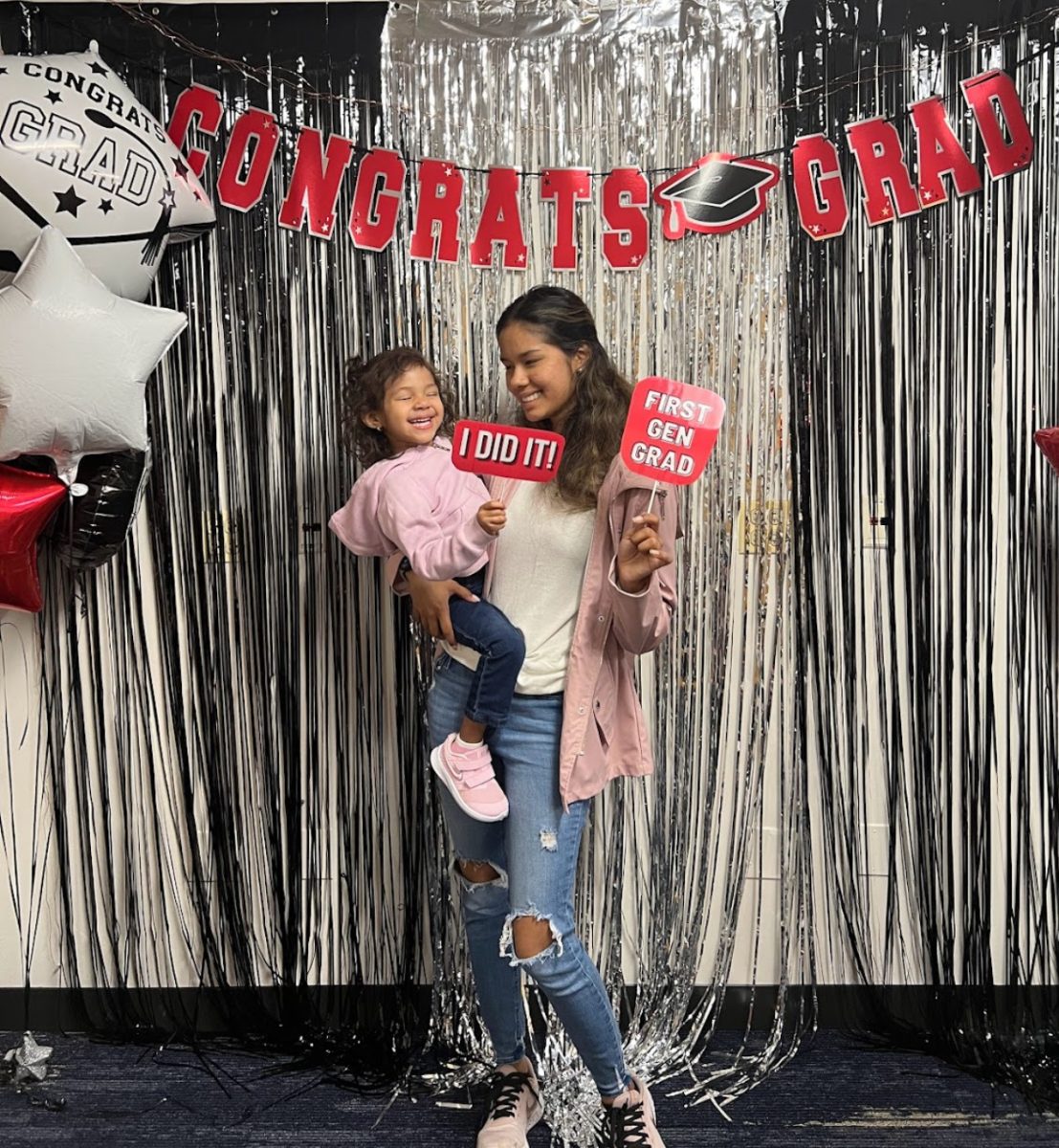 Ilse Arciniega holds her daughter and poses for a photo at a graduation celebration in June 2022. Arciniega is a DePaul graduate student and mother who is graduating June 2024 after achieving her Masters degree. 