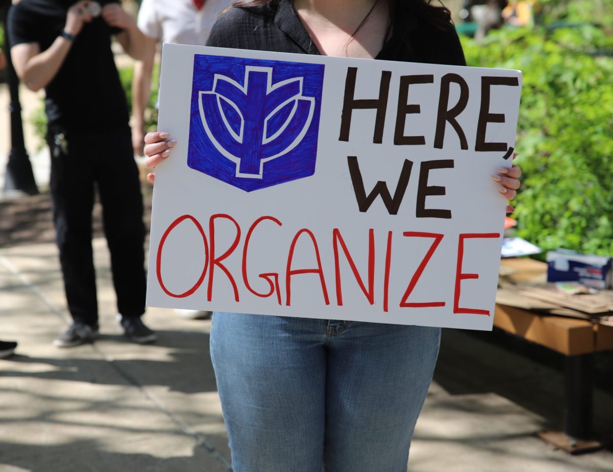 A person striking holds a sign on DePauls Quad, on May 1. 
