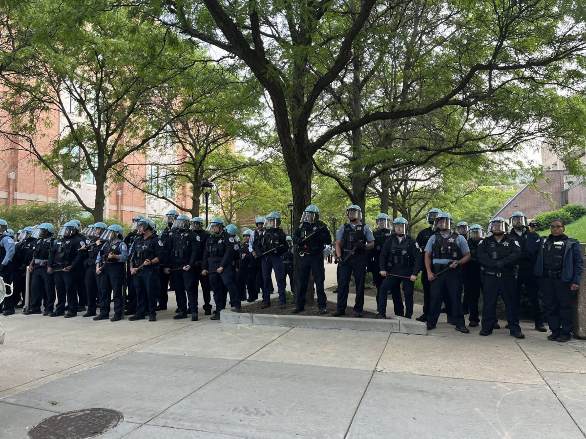 CPD officers block the entrance to the Quad after they, and Public Safety, officers took down the encampment on Thursday, May 16. 