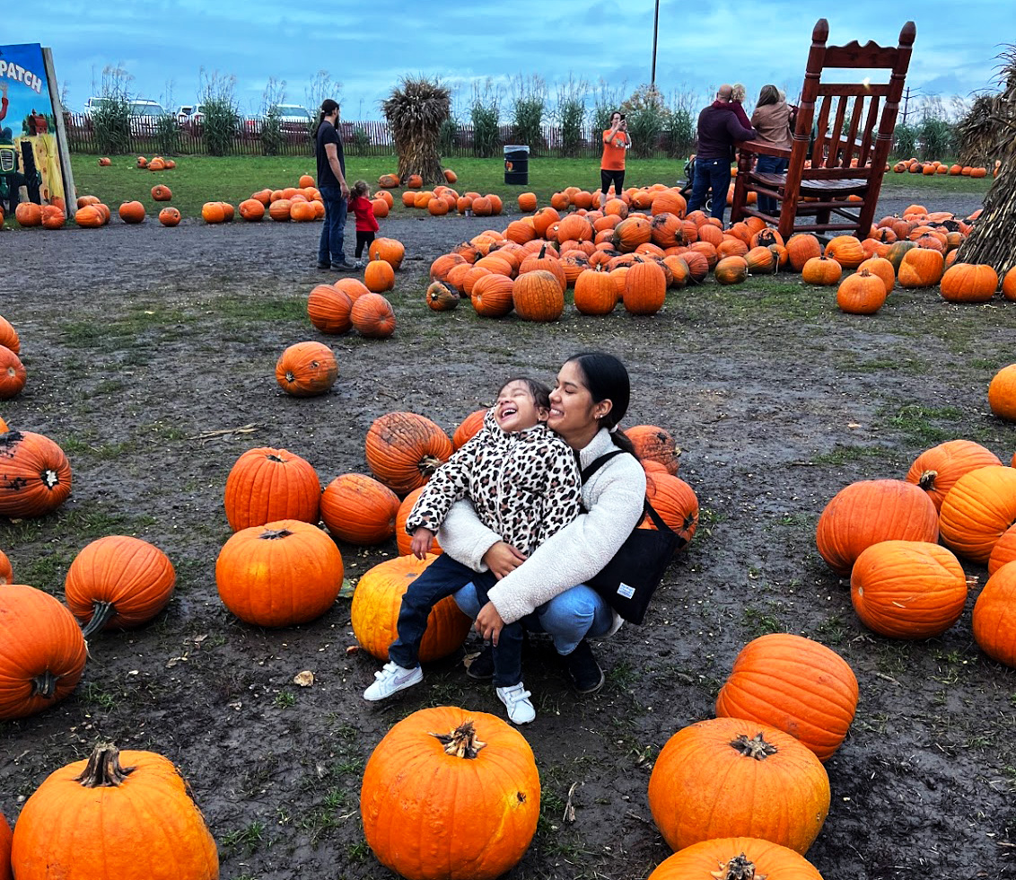 Ilse Arciniega and her daughter, Esli, sit together in a pumpkin patch in October of 2023. The family has made it a tradition to go to a pumpkin patch every year and had to go on a day where Esli had a day off of school. 
Photo provided by Ilse Arciniega.