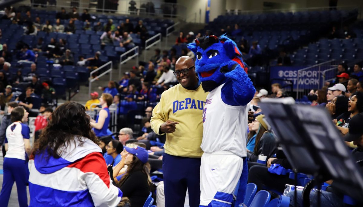 USE THIS CAPTION
Dibs poses for a photo with a fan during a game against Georgetown at Wintrust Arena on Saturday, Feb. 24, 2024. DePaul lost the game 77-76.