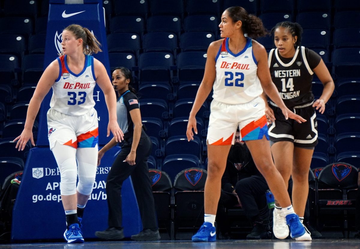 DePaul forward Jorie Allen (No. 33) and guard Anaya Peoples (No. 22) get set on defense in a match against Western Michigan November 6, 2023, at Wintrust Arena.
