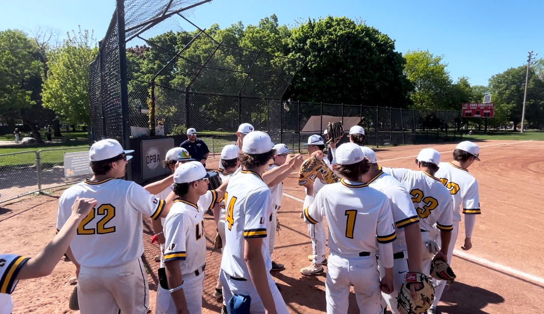 The+Lincoln+Park+Lions+high+school+baseball+team+huddles+before+a+game+on+Wednesday%2C+May+8%2C+2024%2C+in+Chicago.