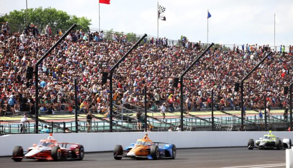 Cars zip around the race track at the Indy 500 on Sunday, May 26, 2024. After a two hour delay, the race started at 4:44 p.m ET. 