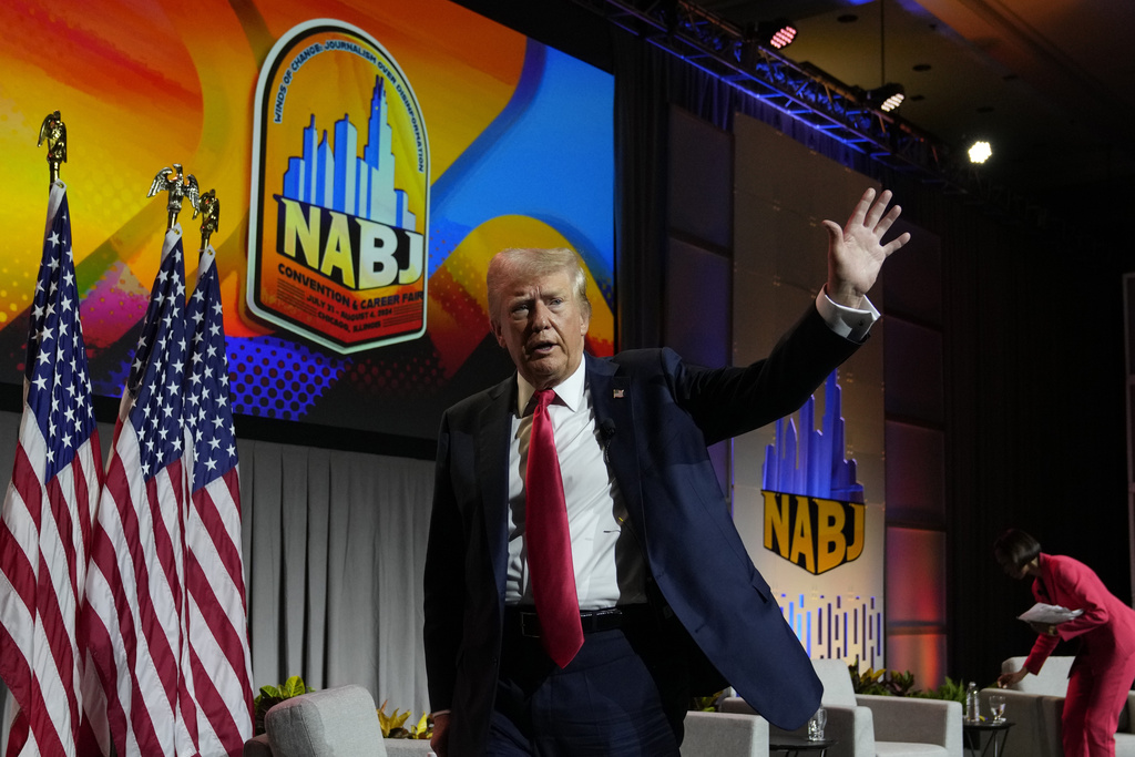 Republican presidential candidate former President Donald Trump walks off stage after speaking at the National Association of Black Journalists, NABJ, convention, Wednesday, July 31, 2024, in Chicago. (AP Photo/Charles Rex Arbogast)