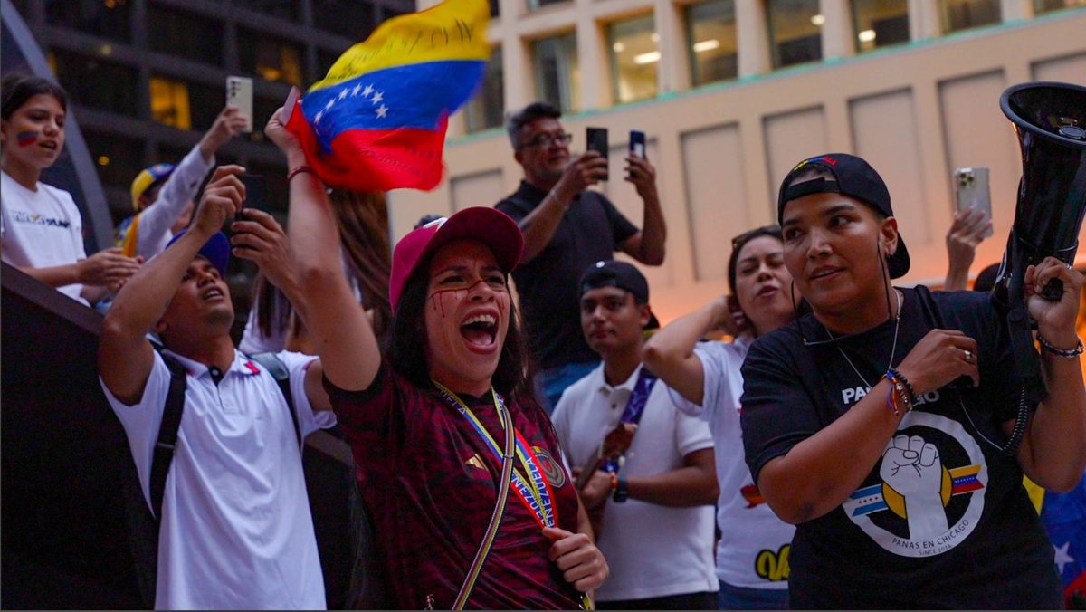 A protester shouts for their country's freedom while waving a Venezuelan flag at Daley Plaza in downtown Chicago on Monday, August 5, 2024. 