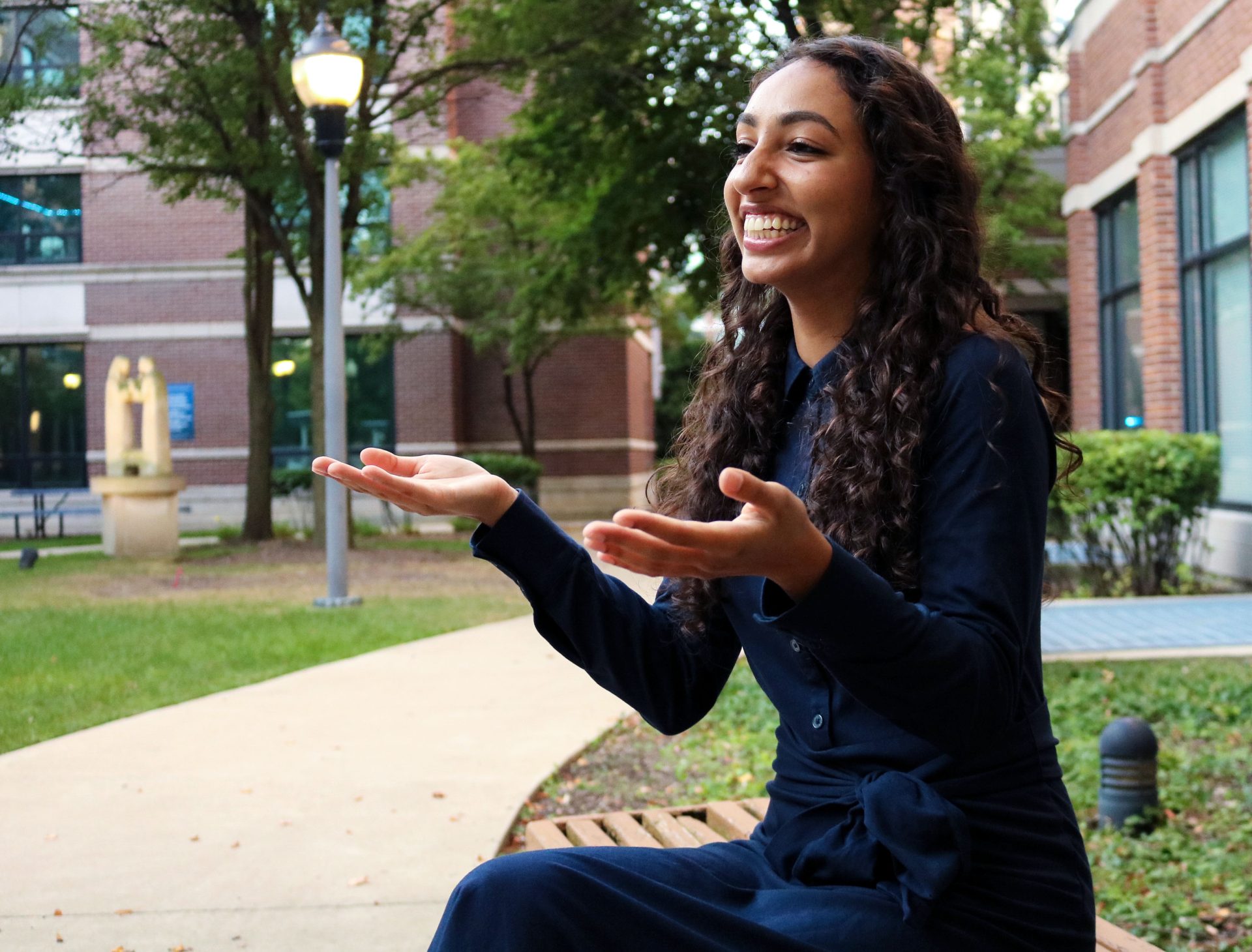 Isabella Ali speaks with a student on Tuesday, Sept. 17, 2024, on campus. Ali is the SGA student body president this year and has previously served as a Chicago Quarter Mentor. 
