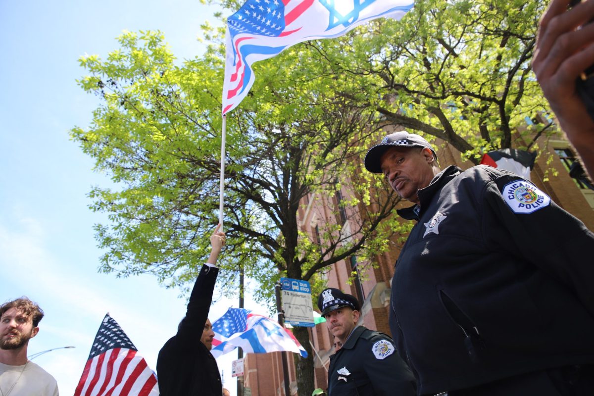 File- Pro-Israel protestors line the street on May 5 in response to DePaul's ongoing pro-Palestinian encampment. Tensions have been raised on campus around the ongoing crisis in the Middle East since last spring. On Nov. 6, two Jewish students were assaulted for wearing pro-Israel attire.