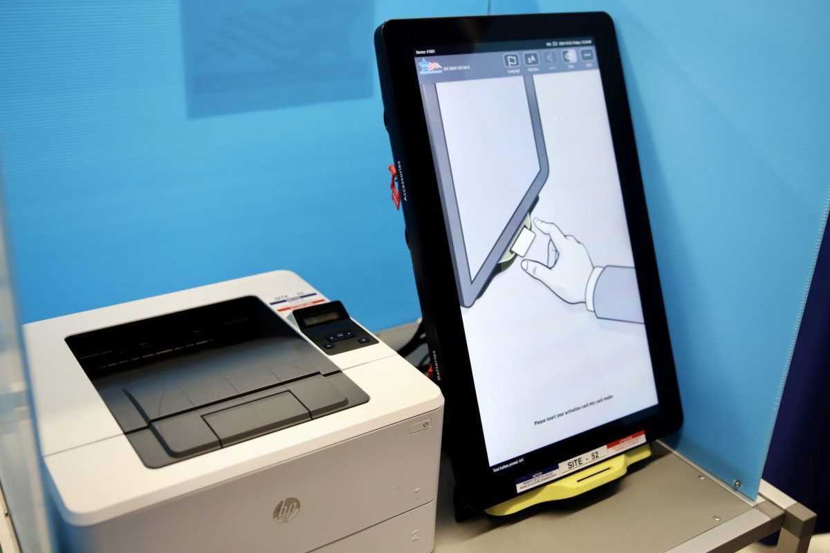 A voting touchscreen sits inside a poll booth at the voting Supersite located at 191 N. Clark Street on Friday, Oct. 25, 2024. Voters can use the touchscreen to choose a ballot option in 12 different languages.