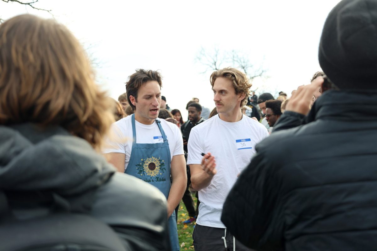 Lookalikes discuss the event with press in Humboldt Park on Saturday, Nov. 17, 2024. The winner was promised $50 and a pack of cigarettes.