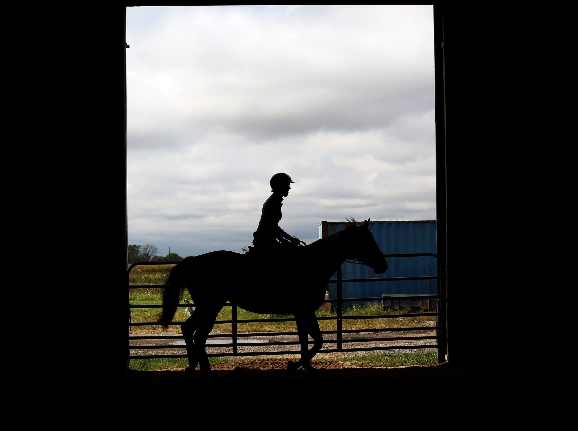 Rylie Sommers rides her horse, Goldfinch, around an indoor arena on Sunday, Sept. 29, 2024, at Stargazer Ranch. Sommers is a DePaul graduate student from Texas and has been riding for 19 years.