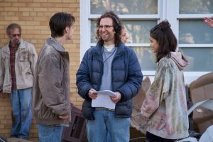 Kyle Mooney (center) directs Jaeden Martell (left) and Rachel Zegler (right) on the set of 'Y2K.' 