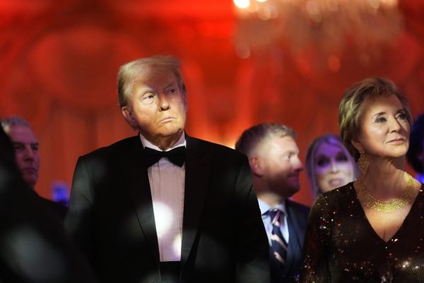 President-elect Donald Trump listens with Linda McMahon during an America First Policy Institute gala at his Mar-a-Lago estate, Thursday, Nov. 14, 2024, in Palm Beach, Fla. (AP Photo/Alex Brandon)