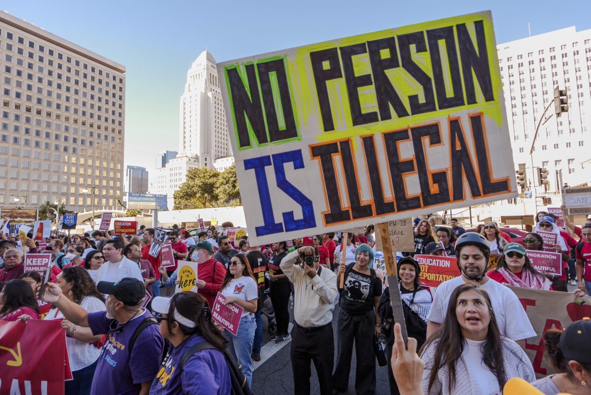 Immigrant rights and social justice organizations and migrant workers participate in a march for "International Day of Action and Solidarity with Migrants" in front of the Federal Building downtown Los Angeles, Wednesday, Dec. 18, 2024. 