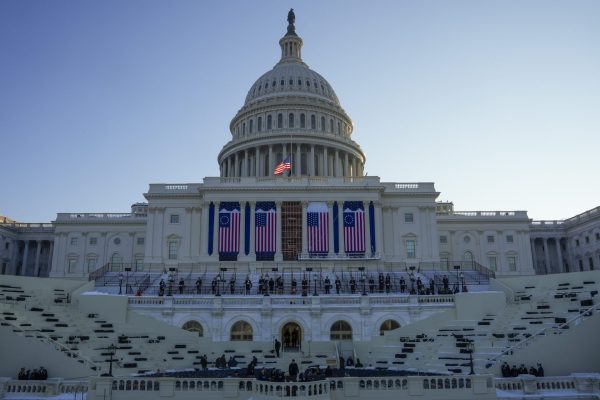 People take their places as a rehearsal begins on the West Front of U.S. Capitol ahead of President-elect Donald Trump's upcoming inauguration, Sunday, Jan. 12, 2025, in Washington. 