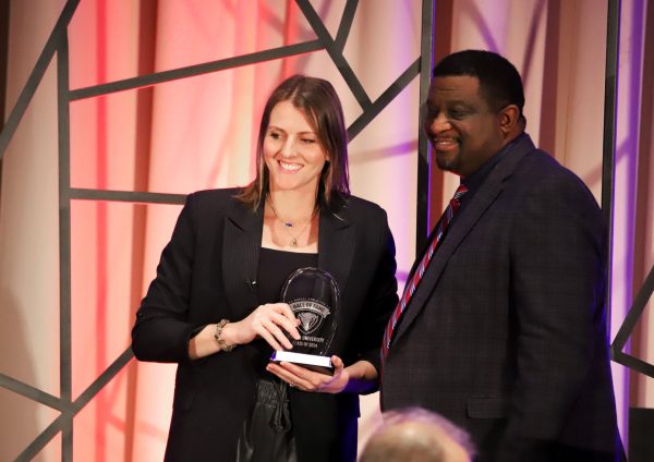 Allie Quigley accepts her DePaul Hall of Fame induction with Director of Athletics DeWayne Peevy on Friday, Jan. 10, 2025, at the Marriott Marquis in Chicago. Quigley scored over 2,000 career points as a Blue Demon and went on to win a WNBA championship with the Chicago Sky.