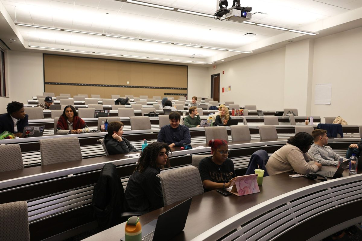 Crowd members talk amongst themselves during the SGA meeting on Wednesday, Oct. 16, 2024, in McGowan South. The SGA fall election took place in Fall quarter, which determined who its new representatives would be.