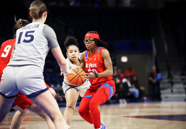 Shakara McCline catches a pass as Xavier's Petra Oborilova guards during the first half of their game on Wednesday, Jan. 22, 2025, at Wintrust Arena. The score was 9-7, with Xavier winning, after the first media timeout.