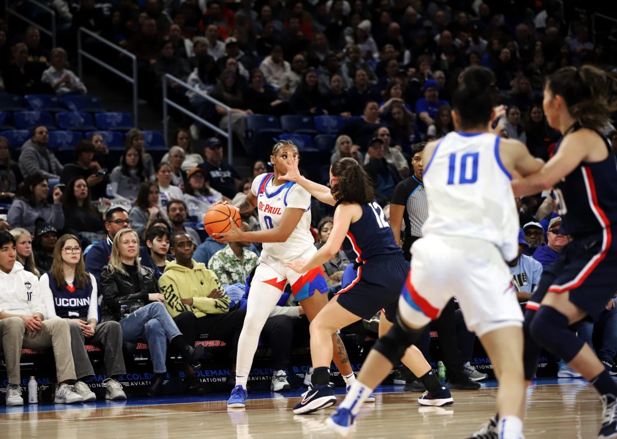 Taylor Johnson-Matthews looks to pass while Ashlynn Shade guards during the first half on Wednesday, Jan. 29, 2025, at Wintrust Arena. The Blue Demons have won two in a row getting to 11-11 on the season.