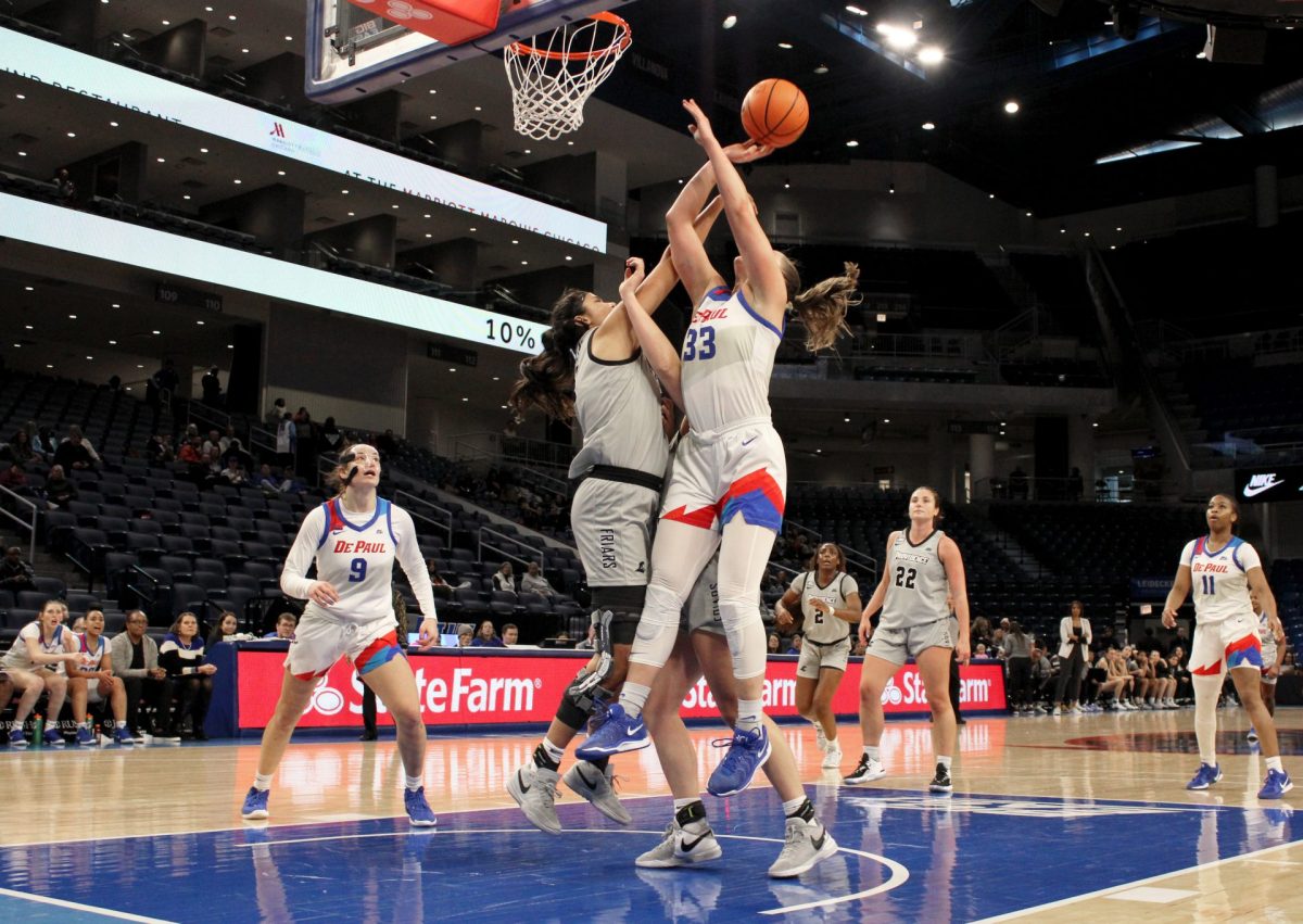 Jorie Allen puts up a shot while Olivia Olsen tries to block on Sunday, Jan. 12, 2025, at Wintrust Arena during the second half of the game. Allen has averaged 17.6 points per game against Big East opponents this season.