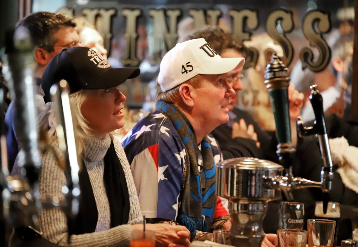 Trump supporters watch the second inauguration of Donald Trump at the Dubliner Pub on Monday, Jan. 20, 2025, in Washington, D.C. The pub was packed with Republicans there to celebrate Trump returning to office. 