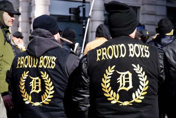 Members of The Proud Boys stand dressed in matching jackets as they gather on Inauguration Day on Monday, Jan. 20, 2025, in Washington, D.C. Chanting and marching, members of the group gathered alongside other Republicans in D.C. to show their support for President Donald Trump.