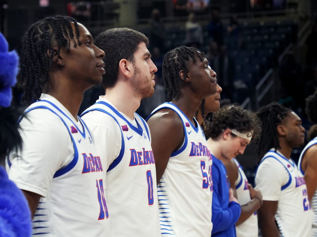 Chris Riddle, Troy D'Amico and Seoku Konneh watch from the sidelines on Tuesday, Jan. 21, 2025. DePaul averages 68.37 points against Big East opponents.