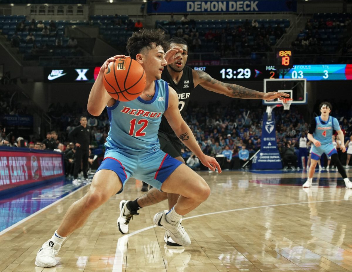 Jacob Meyer dribbles the ball while Xavier's Dayvion McKnight guards on Saturday, Jan. 11, 2025, at Wintrust Arena. Meyer played 23 minutes. 