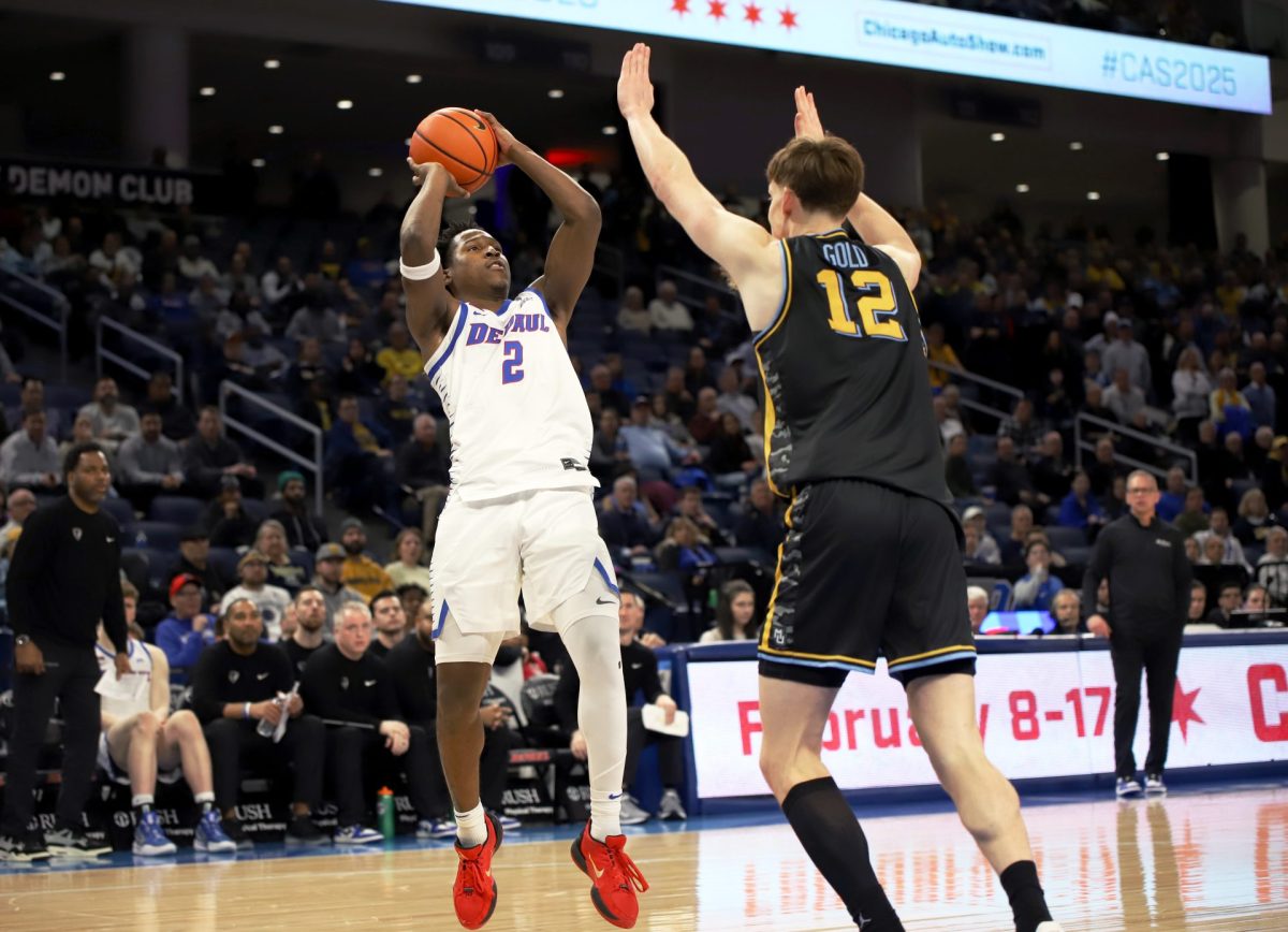 Layden Blocker shoots for a basket while Ben Gold guards during the second half of the game on Tuesday, Jan. 14, 2025, at Wintrust Arena. DePaul made 51.6% of their field goals.