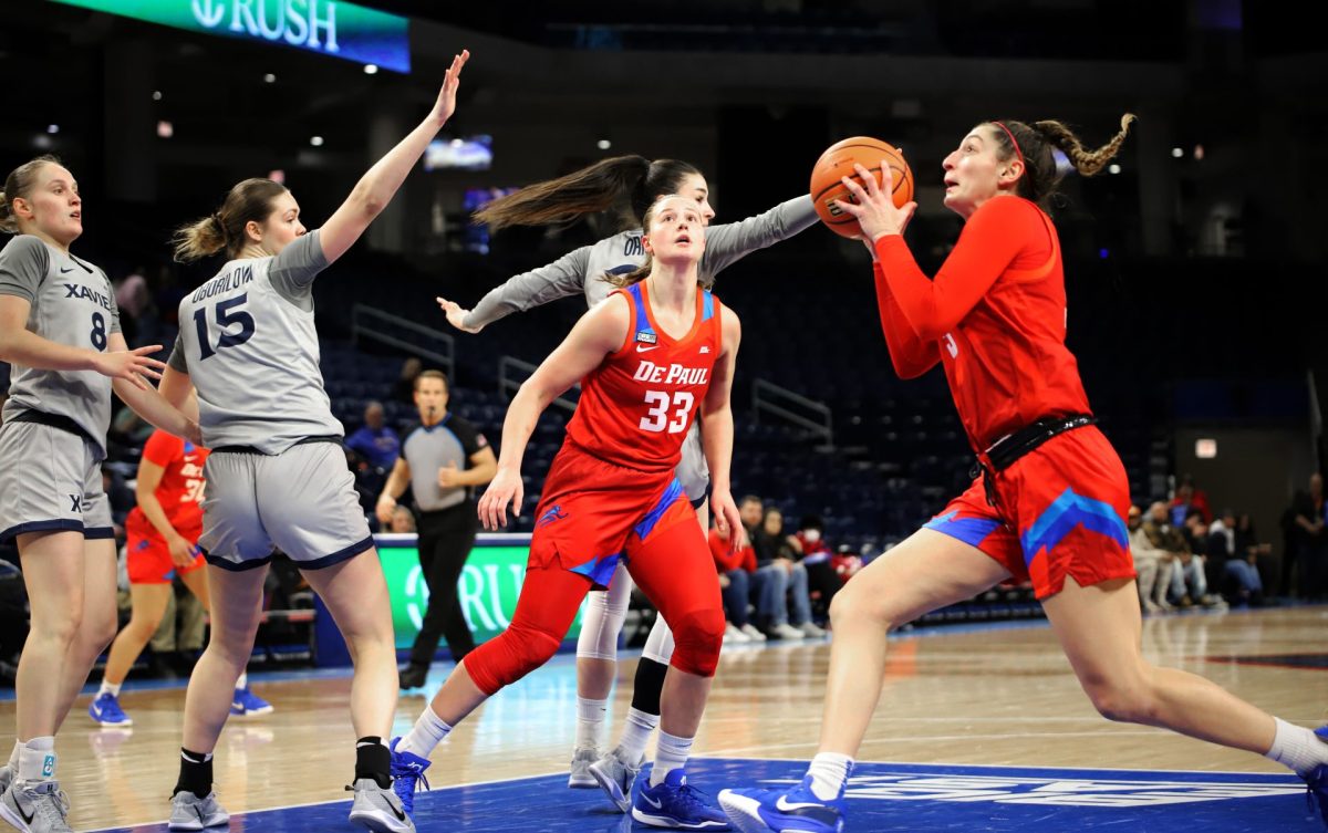 Meg Newman looks to make a shot while Jorie Allen watches on Wednesday, Jan. 22, 2025, at Wintrust Arena. The women’s team is 4-3 in Big East conference play.