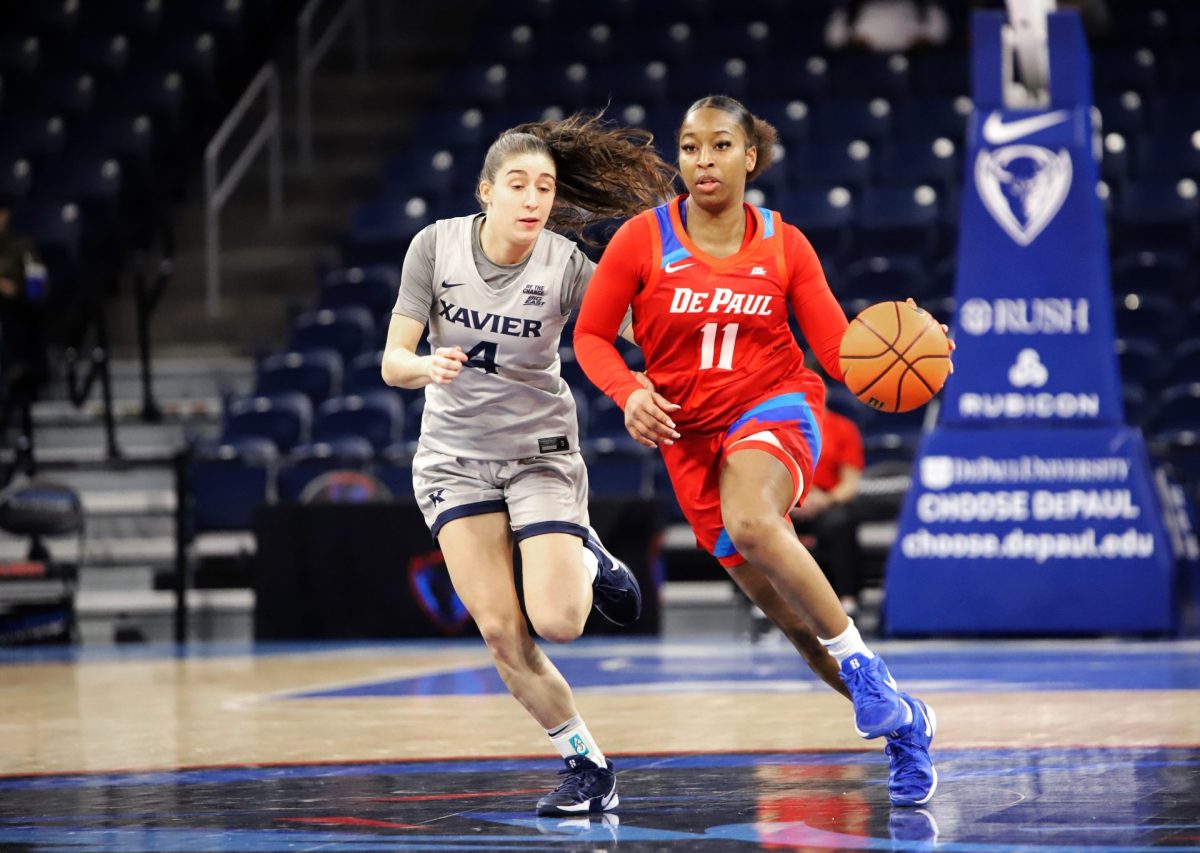 Sumer Lee dribbles down the court while Xavier's Júlia Garcia Roig follows behind on Wednesday, Jan. 22, 2025, at Wintrust Arena. DePaul's women’s team has a 9-11 overall record.