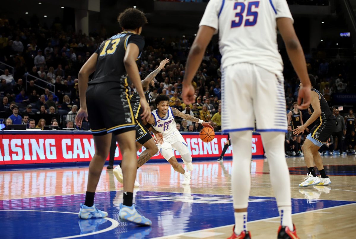 CJ Gunn dribbles around a Marquette defensemen on Tuesday, Jan. 14, 2025, at Wintrust Arena. Gunn played 40 minutes of the game. 