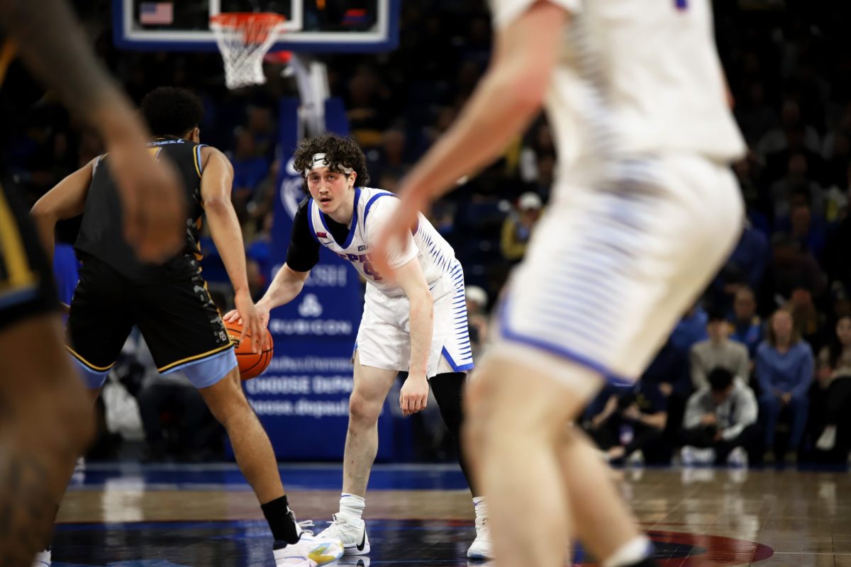 Conor Enright dribbles the ball while looking for a pass on Tuesday, Jan. 14, 2025, during the first half of the DePaul vs Marquette game at Wintrust Arena. Enright is a guard for DePaul.