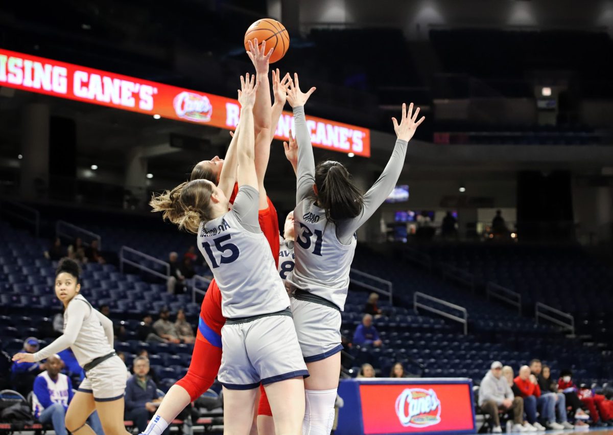 Jorie Allen fights for a rebound against Xavier's Petra Oborilova and Irune Orio on Wednesday, Jan. 22, 2025, at Wintrust Arena. Allen is DePaul's leading scorer. 