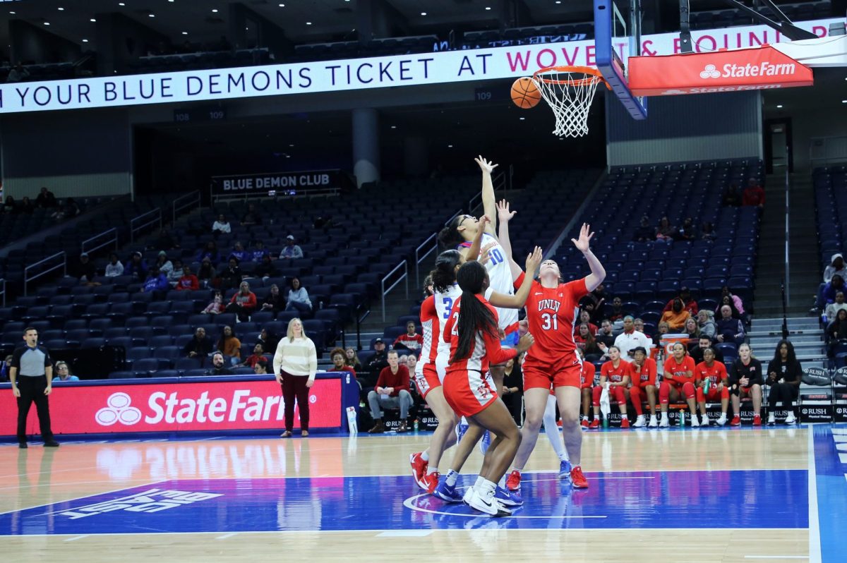 Haley Walker throws the ball up for a basket while players from the University of Nevada, Las Vegas (UNLV) fight for the rebound on Sunday, Dec. 15, 2024, at Wintrust Arena. DePaul lost the game, with a final score of 80-61. 