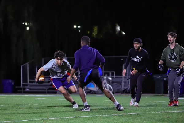 Alexander Floyd dodges another club member during a scrimmage on Thursday, Oct. 17, 2024, in Chicago. The club meets at Maradona Field at Diversey Harbor for the majority of their practices.