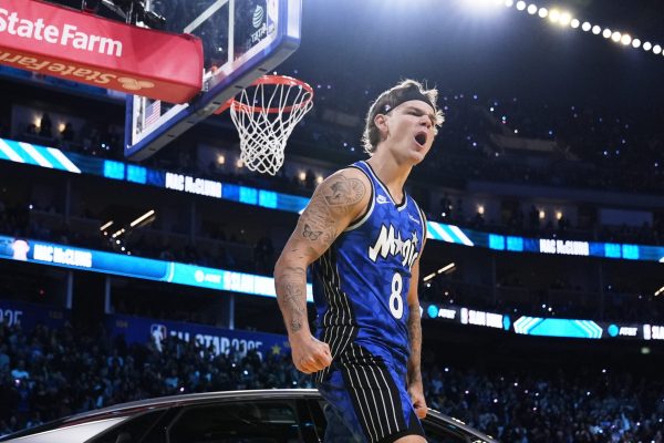 Osceola Magic guard Mac McClung celebrates after dunking over a car during the slam dunk contest at the NBA basketball All-Star Saturday night festivities Saturday, Feb. 15, 2025, in San Francisco. (AP Photo/Godofredo A. Vásquez)