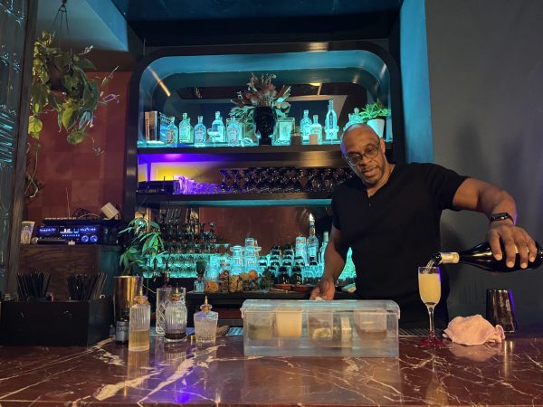 Andrew Lewis pours a drink at the bar at Mahari restaurant in Chicago’s Hyde Park neighborhood on Wednesday, February 19. Mahari offers dishes and drinks from the African diaspora, including Creole, Caribbean and soul food cuisines. 