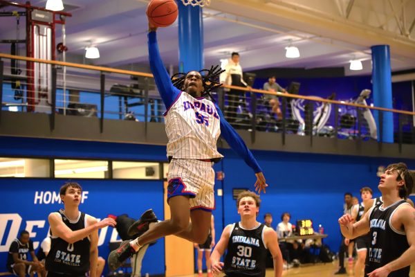 Smiley Cotton attempts a dunk in the Winter Classic Tournament game against Indiana State University on Saturday, Feb. 15, 2025. This is the first time the DePaul men's club basketball team hosted the tournament.